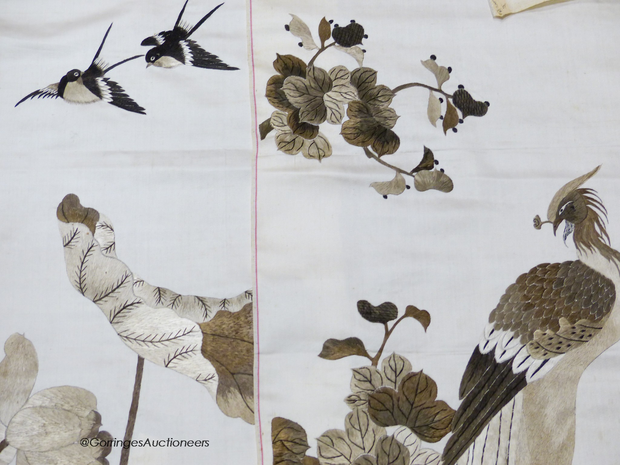 A pair of Chinese embroidered silk panels of birds amid flowers, circa 1900, 130 x 36cm